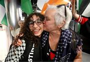 12 May 2024; Sara Kord of Palestine is greeted by Bríd Smith TD on arrival at Dublin Airport as the Palestine women's national football team arrive in Ireland for an International Solidarity Match against Bohemians to be played on Wednesday at Dalymount Park in Dublin. Photo by Stephen McCarthy/Sportsfile