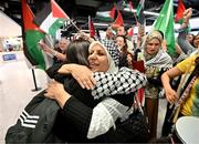 12 May 2024; Hala Sarawi of Palestine is hugged on her arrival at Dublin Airport as the Palestine women's national football team arrive in Ireland for an International Solidarity Match against Bohemians to be played on Wednesday at Dalymount Park in Dublin. Photo by Stephen McCarthy/Sportsfile