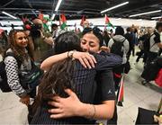 12 May 2024; Nadine Mohamad of Palestine is hugged on her arrival at Dublin Airport as the Palestine women's national football team arrive in Ireland for an International Solidarity Match against Bohemians to be played on Wednesday at Dalymount Park in Dublin. Photo by Stephen McCarthy/Sportsfile