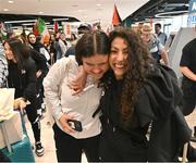 12 May 2024; Charlotte Phillips, left, and Laila Alshaikh of Palestine on arrival at Dublin Airport as the Palestine women's national football team arrive in Ireland for an International Solidarity Match against Bohemians to be played on Wednesday at Dalymount Park in Dublin. Photo by Stephen McCarthy/Sportsfile