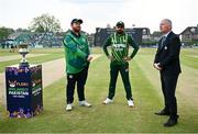 12 May 2024; Ireland captain Paul Stirling, left, with Pakistan captain Babar Azam and match referee Graham McCrea during the coin toss before match two of the Floki Men's T20 International Series between Ireland and Pakistan at Castle Avenue Cricket Ground in Dublin. Photo by Seb Daly/Sportsfile