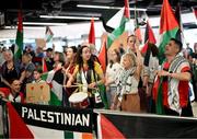 12 May 2024; Supporters await the arrival at Dublin Airport of the Palestine women's national football team. The team arrived in Ireland for an International Solidarity Match against Bohemians to be played on Wednesday at Dalymount Park in Dublin. Photo by Stephen McCarthy/Sportsfile