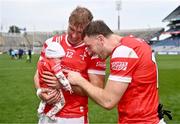 12 May 2024; Conor Grimes of Louth, left, with his daughter Izzy, age 8 weeks, and Louth captain Sam Mulroy after the Leinster GAA Football Senior Championship final match between Dublin and Louth at Croke Park in Dublin. Photo by Ben McShane/Sportsfile