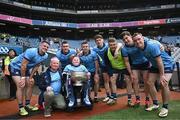 12 May 2024; Dublin supporter Cathal Briscoe with the Delaney Cup and Dublin players after their side's victory in the Leinster GAA Football Senior Championship final match between Dublin and Louth at Croke Park in Dublin. Photo by Harry Murphy/Sportsfile