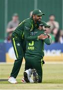 12 May 2024; Mohammad Amir of Pakistan, right, celebrates with teammate Babar Azam after taking the wicket of Ireland's Paul Stirling during match two of the Floki Men's T20 International Series between Ireland and Pakistan at Castle Avenue Cricket Ground in Dublin. Photo by Seb Daly/Sportsfile