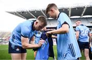 12 May 2024; Seán Bugler of Dublin signs the jersey of a supporter afterhs side's victory in the Leinster GAA Football Senior Championship final match between Dublin and Louth at Croke Park in Dublin. Photo by Shauna Clinton/Sportsfile