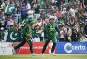 12 May 2024; Shaheen Shah Afridi of Pakistan, right, celebrates with teammate Iftikhar Ahmad after taking the wicket of Ireland's Harry Tector during match two of the Floki Men's T20 International Series between Ireland and Pakistan at Castle Avenue Cricket Ground in Dublin. Photo by Seb Daly/Sportsfile