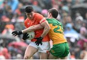 12 May 2024; Joe McElroy of Armagh in action against Eoghán Bán Gallagher of Donegal during the Ulster GAA Football Senior Championship final match between Armagh and Donegal at St Tiernach's Park in Clones, Monaghan. Photo by Ramsey Cardy/Sportsfile