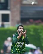12 May 2024; Mohammad Amir of Pakistan takes the wicket of Ireland's Curtis Campher, caught and bowled, during match two of the Floki Men's T20 International Series between Ireland and Pakistan at Castle Avenue Cricket Ground in Dublin. Photo by Seb Daly/Sportsfile