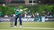 12 May 2024; Lorcan Tucker of Ireland plays a shot to bring up his half-century during match two of the Floki Men's T20 International Series between Ireland and Pakistan at Castle Avenue Cricket Ground in Dublin. Photo by Seb Daly/Sportsfile