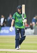 12 May 2024; Lorcan Tucker of Ireland acknowledges the crowd after scoring 50 runs during match two of the Floki Men's T20 International Series between Ireland and Pakistan at Castle Avenue Cricket Ground in Dublin. Photo by Seb Daly/Sportsfile