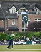 12 May 2024; Spectators watch the action from nearby housing during match two of the Floki Men's T20 International Series between Ireland and Pakistan at Castle Avenue Cricket Ground in Dublin. Photo by Seb Daly/Sportsfile