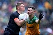 12 May 2024; Armagh goalkeeper Blaine Hughes in action against Mark Curran of Donegal during the Ulster GAA Football Senior Championship final match between Armagh and Donegal at St Tiernach's Park in Clones, Monaghan. Photo by Piaras Ó Mídheach/Sportsfile