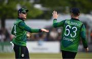 12 May 2024; Gareth Delany of Ireland, left, is congratulated by teammate Andrew Balbirnie after taking the wicket of Pakistan's Fakhar Zaman during match two of the Floki Men's T20 International Series between Ireland and Pakistan at Castle Avenue Cricket Ground in Dublin. Photo by Seb Daly/Sportsfile