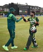 12 May 2024; Pakistan captain Babar Azam, left, and teammate Mohammad Rizwan after their side's vicotry during match two of the Floki Men's T20 International Series between Ireland and Pakistan at Castle Avenue Cricket Ground in Dublin. Photo by Seb Daly/Sportsfile