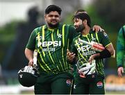 12 May 2024; Pakistan players Mohammad Rizwan, right, and Azam Khan after their side's victory during match two of the Floki Men's T20 International Series between Ireland and Pakistan at Castle Avenue Cricket Ground in Dublin. Photo by Seb Daly/Sportsfile