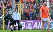 12 May 2024; Shane McPartlan of Armagh reacts after his penalty was saved by Donegal goalkeeper Shaun Patton, behind, for the last penalty in the penalty shoot-out of the Ulster GAA Football Senior Championship final match between Armagh and Donegal at St Tiernach's Park in Clones, Monaghan. Photo by Piaras Ó Mídheach/Sportsfile