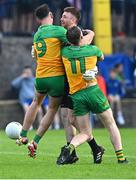 12 May 2024; Donegal goalkeeper Shaun Patton celebrates with team-mates Michael Langan, 9, and Ciaran Thompson, 11, after saving the final penalty, from Shane McPartlan of Armagh, in the penalty shoot-out of the Ulster GAA Football Senior Championship final match between Armagh and Donegal at St Tiernach's Park in Clones, Monaghan. Photo by Piaras Ó Mídheach/Sportsfile