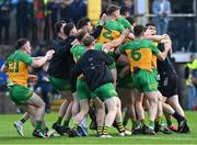 12 May 2024; Donegal players celebrate after their side's victory in the penalty shoot-out of the Ulster GAA Football Senior Championship final match between Armagh and Donegal at St Tiernach's Park in Clones, Monaghan. Photo by Piaras Ó Mídheach/Sportsfile
