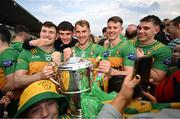 12 May 2024; Donegal players celebrate with the Anglo Celt cup after the Ulster GAA Football Senior Championship final match between Armagh and Donegal at St Tiernach's Park in Clones, Monaghan. Photo by Ramsey Cardy/Sportsfile