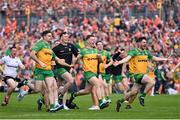 12 May 2024; Donegal players Caolan McGonagle, Mark Curran and Ryan McHugh celebrate winning the penalty shoot-out after the Ulster GAA Football Senior Championship final match between Armagh and Donegal at St Tiernach's Park in Clones, Monaghan. Photo by Ramsey Cardy/Sportsfile