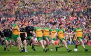 12 May 2024; Donegal players celebrate winning the penalty shoot-out after the Ulster GAA Football Senior Championship final match between Armagh and Donegal at St Tiernach's Park in Clones, Monaghan. Photo by Ramsey Cardy/Sportsfile