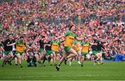 12 May 2024; Donegal players celebrate winning the penalty shoot-out after the Ulster GAA Football Senior Championship final match between Armagh and Donegal at St Tiernach's Park in Clones, Monaghan. Photo by Ramsey Cardy/Sportsfile