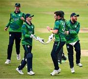 12 May 2024; Mark Adair of Ireland, second from right, is congratulated by teammates during match two of the Floki Men's T20 International Series between Ireland and Pakistan at Castle Avenue Cricket Ground in Dublin. Photo by Seb Daly/Sportsfile