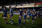 11 May 2024; Leinster players Josh van der Flier, Ross Byrne and Robbie Henshaw walk out with match day mascots before the United Rugby Championship match between Leinster and Ospreys at the RDS Arena in Dublin. Photo by Harry Murphy/Sportsfile