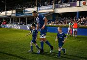 11 May 2024; Jason Jenkins of Leinster runs out with matchday mascots Con Barry and Evan Kealy before the United Rugby Championship match between Leinster and Ospreys at the RDS Arena in Dublin. Photo by Harry Murphy/Sportsfile