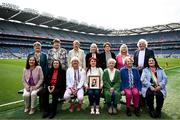12 May 2024; The 1974 Offaly All-Ireland final team, back row, from left, Phyllis Hackett, Ann Molloy, Catherine Hanlon, Mary Lowry, Mary Nevin, Mary Carroll and manager Brendan Martin. Front row, from left, Lucy Bryant, Catherine Conroy, Fidelma Geraghty, Kathleen Buckley, Tona McDonald, Mary Todd and Agnes Gorman at half time of the Leinster LGFA Senior Football Championship final match between Dublin and Meath at Croke Park in Dublin. Photo by Harry Murphy/Sportsfile