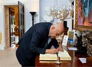 13 May 2024; Jibril Rajoub, president of the Palestinian Football Association and chair of the Palestinian Olympic Committee, signs the guest book on arrival for The President of Ireland Michael D Higgins to receive representatives of the Palestinian Football Association and Bohemian Football Club at Áras an Uachtaráin in Dublin. Palestine women's national football team are in Ireland for an International Solidarity Match against Bohemians women's team to be played on Wednesday, May 15, at Dalymount Park in Dublin. Photo by Stephen McCarthy/Sportsfile