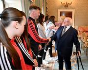 13 May 2024; The President of Ireland Michael D Higgins with Bohemians manager Ken Kiernan during a courtesy call with representatives of the Palestinian Football Association and Bohemian Football Club at Áras an Uachtaráin in Dublin. Palestine women's national football team are in Ireland for an International Solidarity Match against Bohemians women's team to be played on Wednesday, May 15, at Dalymount Park in Dublin. Photo by Stephen McCarthy/Sportsfile