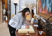13 May 2024; Palestine's Jeniver Shattara signs the guest book on arrival for The President of Ireland Michael D Higgins to receive representatives of the Palestinian Football Association and Bohemian Football Club at Áras an Uachtaráin in Dublin. Palestine women's national football team are in Ireland for an International Solidarity Match against Bohemians women's team to be played on Wednesday, May 15, at Dalymount Park in Dublin. Photo by Stephen McCarthy/Sportsfile