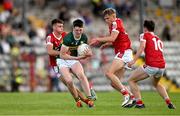 13 May 2024; Ben Murphy of Kerry in action against Cork players Cian O’Connor, Harry Cogan and Danny Miskella during the Electric Ireland Munster GAA Football Minor Championship Final match between Cork and Kerry at Páirc Ui Rinn in Cork. Photo by Brendan Moran/Sportsfile