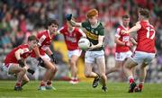 13 May 2024; Jack Joy of Kerry in action against Cork players Joe Mouret, Oisin Harrington and Cian Cooney during the Electric Ireland Munster GAA Football Minor Championship Final match between Cork and Kerry at Páirc Ui Rinn in Cork. Photo by Brendan Moran/Sportsfile