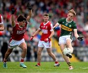 13 May 2024; Michael Horan of Kerry in action against Oisin Harrington of Cork during the Electric Ireland Munster GAA Football Minor Championship Final match between Cork and Kerry at Páirc Ui Rinn in Cork. Photo by Brendan Moran/Sportsfile