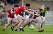 13 May 2024; Gavin O’Keeffe of Kerry in action against Danny Miskella, left, and Jack Trench of Cork during the Electric Ireland Munster GAA Football Minor Championship Final match between Cork and Kerry at Páirc Ui Rinn in Cork. Photo by Brendan Moran/Sportsfile