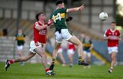 13 May 2024; Ronan Carroll of Kerry in action against Niall O’Shea of Cork during the Electric Ireland Munster GAA Football Minor Championship Final match between Cork and Kerry at Páirc Ui Rinn in Cork. Photo by Brendan Moran/Sportsfile