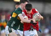 13 May 2024; Sean Whelton of Cork is tackled by Fionnan Ryan of Kerry during the Electric Ireland Munster GAA Football Minor Championship Final match between Cork and Kerry at Páirc Ui Rinn in Cork. Photo by Brendan Moran/Sportsfile