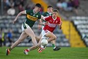 13 May 2024; Ben Murphy of Kerry in action against Harry Cogan of Cork during the Electric Ireland Munster GAA Football Minor Championship Final match between Cork and Kerry at Páirc Ui Rinn in Cork. Photo by Brendan Moran/Sportsfile