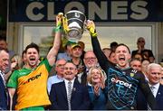 12 May 2024; Donegal's Brendan McCole, left, and Gavin Mulreany lifts the Anglo Celt Cup after the Ulster GAA Football Senior Championship final match between Armagh and Donegal at St Tiernach's Park in Clones, Monaghan. Photo by Ramsey Cardy/Sportsfile