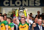 12 May 2024; Jeaic MacCeallbhuí of Donegal lifts the Anglo Celt Cup after the Ulster GAA Football Senior Championship final match between Armagh and Donegal at St Tiernach's Park in Clones, Monaghan. Photo by Ramsey Cardy/Sportsfile