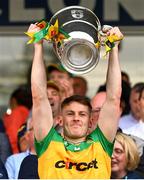 12 May 2024; Mark Curran of Donegal lifts the Anglo Celt Cup after the Ulster GAA Football Senior Championship final match between Armagh and Donegal at St Tiernach's Park in Clones, Monaghan. Photo by Ramsey Cardy/Sportsfile
