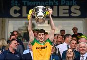 12 May 2024; Domhnall MacGiolla Bhride of Donegal lifts the Anglo Celt Cup after the Ulster GAA Football Senior Championship final match between Armagh and Donegal at St Tiernach's Park in Clones, Monaghan. Photo by Ramsey Cardy/Sportsfile