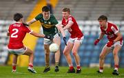 13 May 2024; Ronan Carroll of Kerry in action against Cork players, Oisin Harrington, Cathal McCarthy and Aaron Keane during the Electric Ireland Munster GAA Football Minor Championship Final match between Cork and Kerry at Páirc Ui Rinn in Cork. Photo by Brendan Moran/Sportsfile