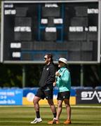 14 May 2024; Ireland head coach Heinrich Malan, right, and Mark Adair of Ireland in conversation before match three of the Floki Men's T20 International Series between Ireland and Pakistan at Castle Avenue Cricket Ground in Dublin. Photo by Sam Barnes/Sportsfile