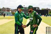 14 May 2024; Ireland captain Lorcan Tucker and Pakistan captain Babar Azam shake hands before match three of the Floki Men's T20 International Series between Ireland and Pakistan at Castle Avenue Cricket Ground in Dublin. Photo by Sam Barnes/Sportsfile