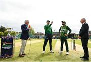 14 May 2024; Ireland captain Lorcan Tucker makes the toss, watched by from left, HBV Studios presenter Alan Wilkins, Pakistan captain Babar Azam and match referee Graham McCrea  before match three of the Floki Men's T20 International Series between Ireland and Pakistan at Castle Avenue Cricket Ground in Dublin. Photo by Sam Barnes/Sportsfile