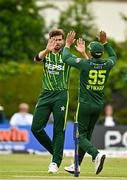 14 May 2024; Shaheen Shah Afridi of Pakistan, left, celebrates with team-mate Iftikhar Ahmad after bowling Ross Adair of Ireland during match three of the Floki Men's T20 International Series between Ireland and Pakistan at Castle Avenue Cricket Ground in Dublin. Photo by Sam Barnes/Sportsfile